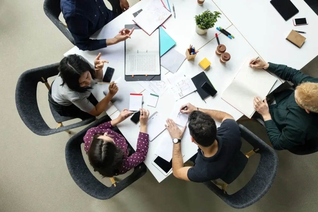 Group of people working together shot from above